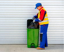 janitor-takes-garbage-out-of-trash-container-outdo-2023-05-17-18-02-39-utc 1.png